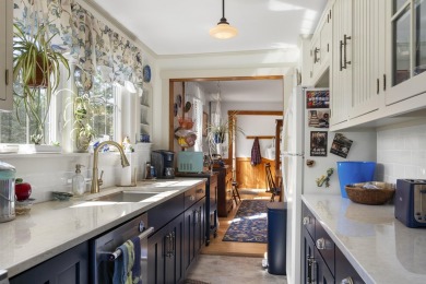 Welcome to this beautifully updated New England-style home with