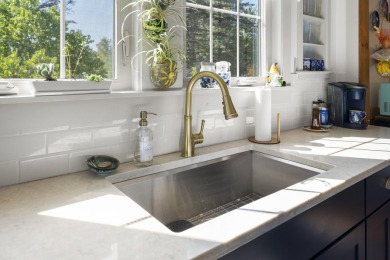 Welcome to this beautifully updated New England-style home with