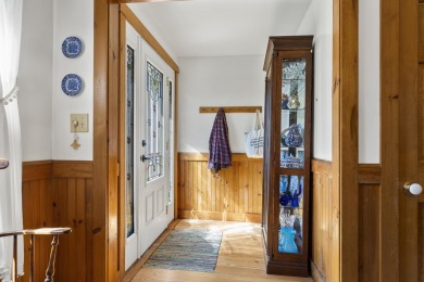 Welcome to this beautifully updated New England-style home with