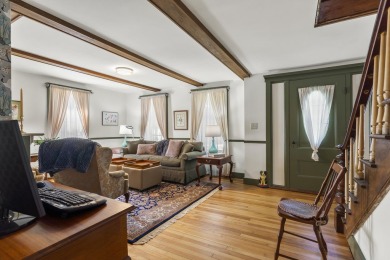 Welcome to this beautifully updated New England-style home with