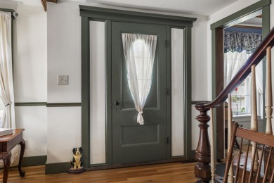 Welcome to this beautifully updated New England-style home with