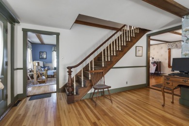 Welcome to this beautifully updated New England-style home with