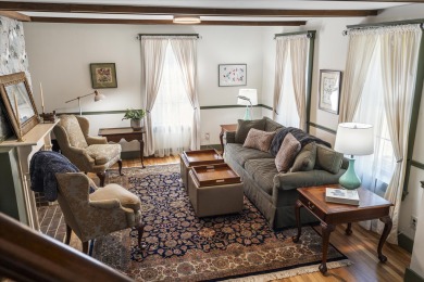 Welcome to this beautifully updated New England-style home with