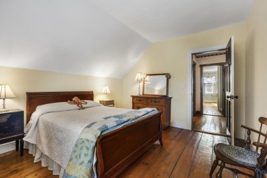 Welcome to this beautifully updated New England-style home with