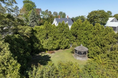 Welcome to this beautifully updated New England-style home with