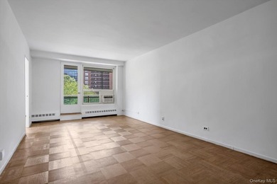 Welcome to this spacious and inviting 2-bedroom, 1-bath co-op - photo 2