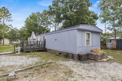 This single-wide home is a solid addition to any rental - photo 2