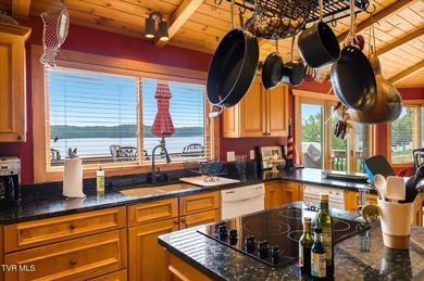 Stunning log home on the main channel of Douglas Lake! This - photo 15