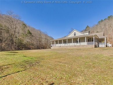 Set on 1.25 private acres, this 3,204-square-foot home offers - photo 3