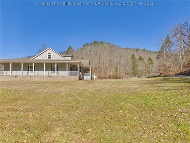 Set on 1.25 private acres, this 3,204-square-foot home offers - photo 4