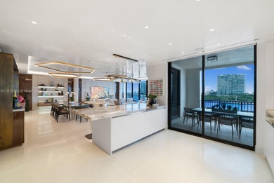 This elegantly designed 4-bedroom, 4.5-bath residence at Palazzo