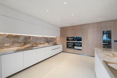 This elegantly designed 4-bedroom, 4.5-bath residence at Palazzo