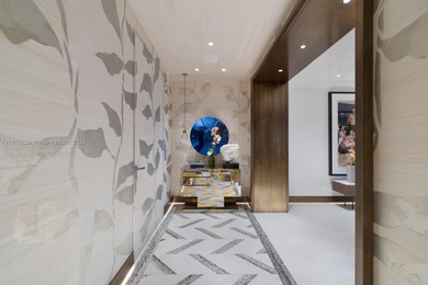 This elegantly designed 4-bedroom, 4.5-bath residence at Palazzo