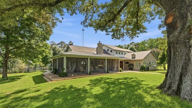 A serene 12 acres of lush pastureland and mature trees, this - photo 2
