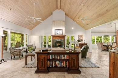 A serene 12 acres of lush pastureland and mature trees, this - photo 6