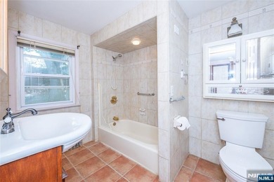 This income-producing two-family home lies in the heart of - photo 17