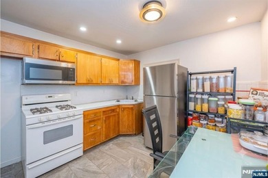 This income-producing two-family home lies in the heart of - photo 20