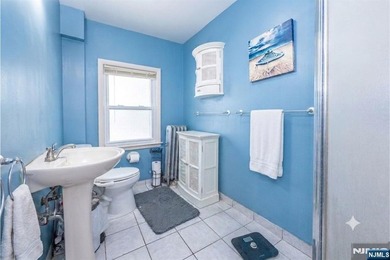This income-producing two-family home lies in the heart of - photo 21