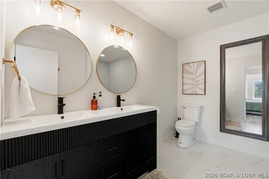 Lakefront living on 2 private acres at the 8MM near Laurie! - photo 32