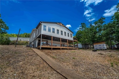 Lakefront living on 2 private acres at the 8MM near Laurie! - photo 36
