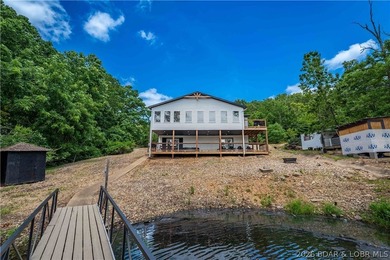 Lakefront living on 2 private acres at the 8MM near Laurie! - photo 38