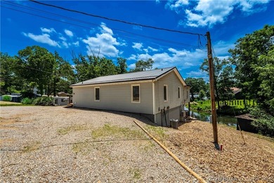 Lakefront living on 2 private acres at the 8MM near Laurie! - photo 41