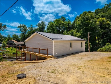 Lakefront living on 2 private acres at the 8MM near Laurie! - photo 42