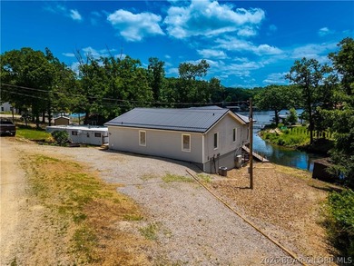 Lakefront living on 2 private acres at the 8MM near Laurie! - photo 43