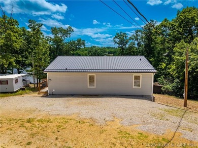 Lakefront living on 2 private acres at the 8MM near Laurie! - photo 44