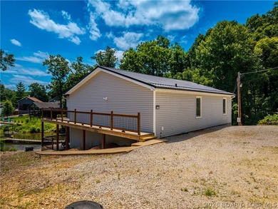 Lakefront living on 2 private acres at the 8MM near Laurie! - photo 45