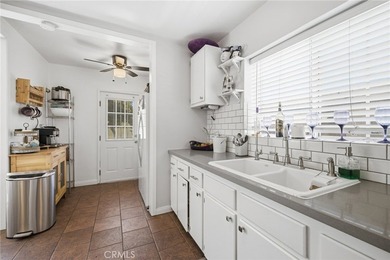 Nestled on a quiet tree lined street in North Long Beach, this - photo 18