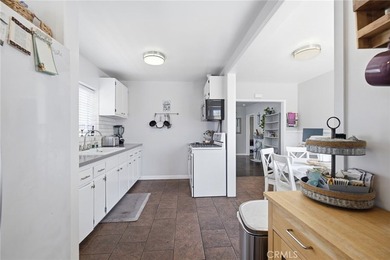 Nestled on a quiet tree lined street in North Long Beach, this - photo 20