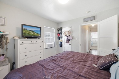 Nestled on a quiet tree lined street in North Long Beach, this - photo 24