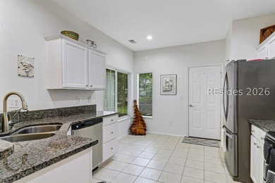 Tucked beneath a canopy of mature trees on the desirable - photo 14