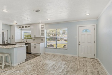 Embrace the ultimate beachside lifestyle in this beautifully - photo 9