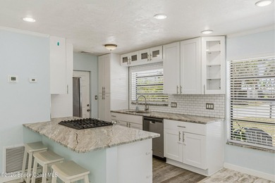 Embrace the ultimate beachside lifestyle in this beautifully - photo 10
