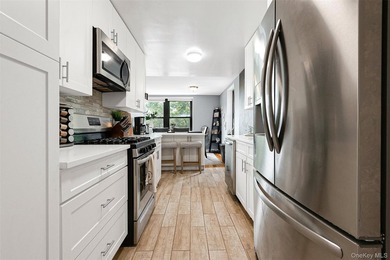 Welcome to this sprawling 3-bedroom, 2-bathroom corner unit in - photo 13