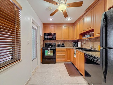 Step inside to discover an updated kitchen with modern finishes - photo 10