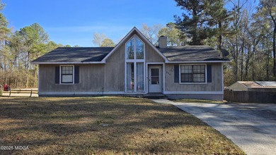 Nestled in the desirable gated community of Lake Wildwood, this - Lake Home For Sale in Macon, Georgia
