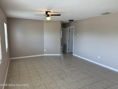 Step inside to find tile flooring flowing throughout the main - photo 7