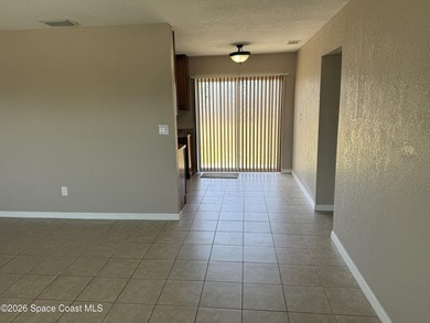 Step inside to find tile flooring flowing throughout the main - photo 8