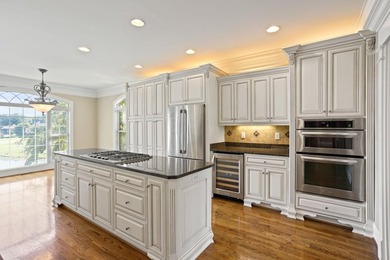 Luxury Brick Home on Golf Course with Pond View-3BR|4.5BA| 4-Car - photo 11