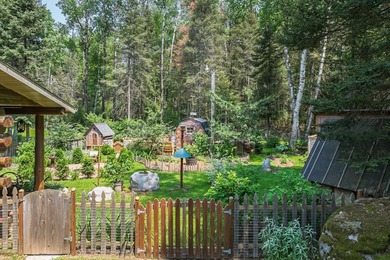 Set on 1.19 wooded acres in the heart of Sugar Camp, this 1,746 - photo 20