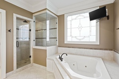 Luxury Brick Home on Golf Course with Pond View-3BR|4.5BA| 4-Car - photo 21
