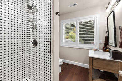 Set on a private half-acre at the end of a quiet street, this