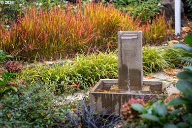 Set on a private half-acre at the end of a quiet street, this