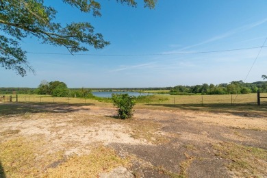 A 6.79-acre stunning lake front lot that's mostly cleared with a - photo 3