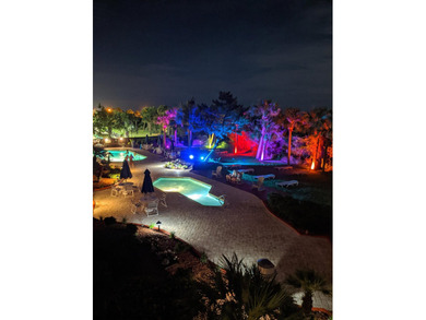 Welcome to Unit 205 at Beach Colony Resort, a charming 1-bedroom - photo 35