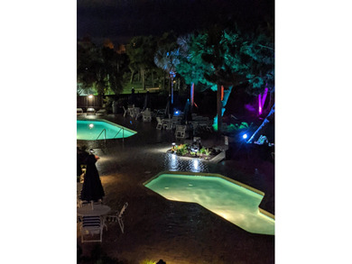 Welcome to Unit 205 at Beach Colony Resort, a charming 1-bedroom - photo 37