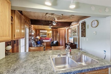 Enjoy the Lake of the Ozarks lifestyle with this charming Rocky - photo 11